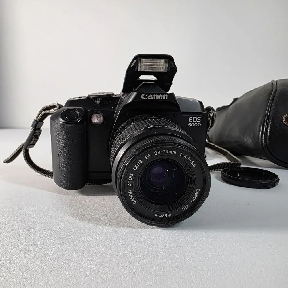 Canon EOS 5000 with 38-76mm EF zoom, UV filter, strap